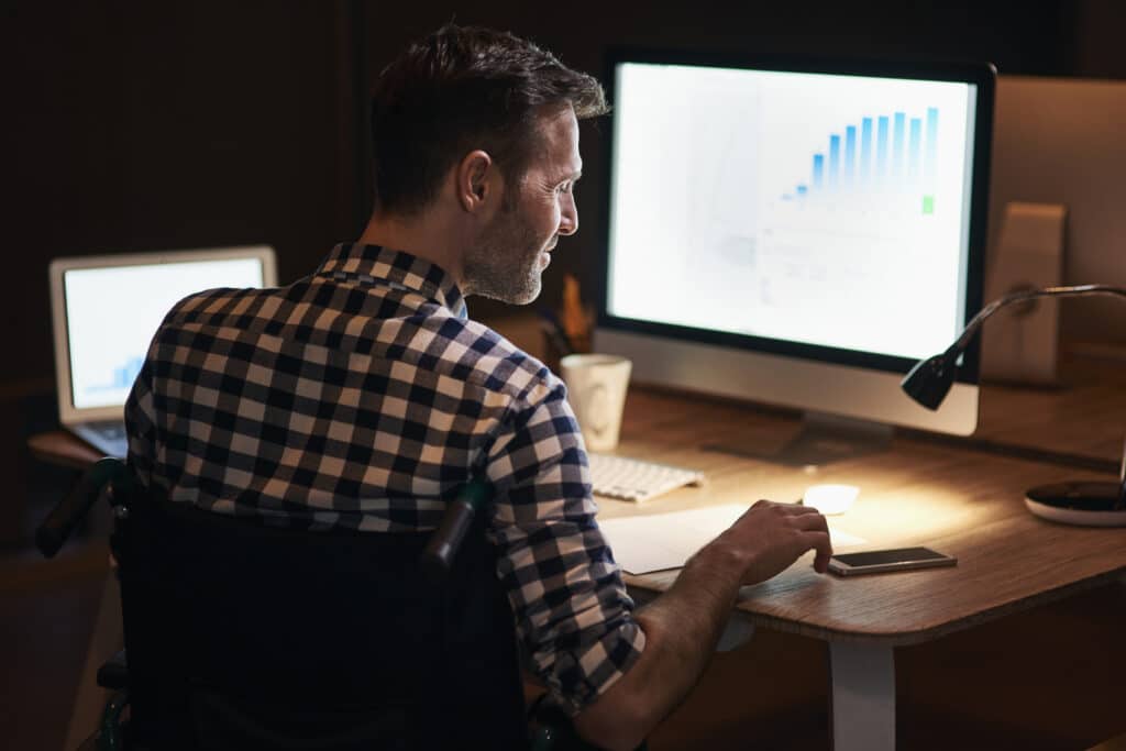 man working with tech for wordpress maintenance.