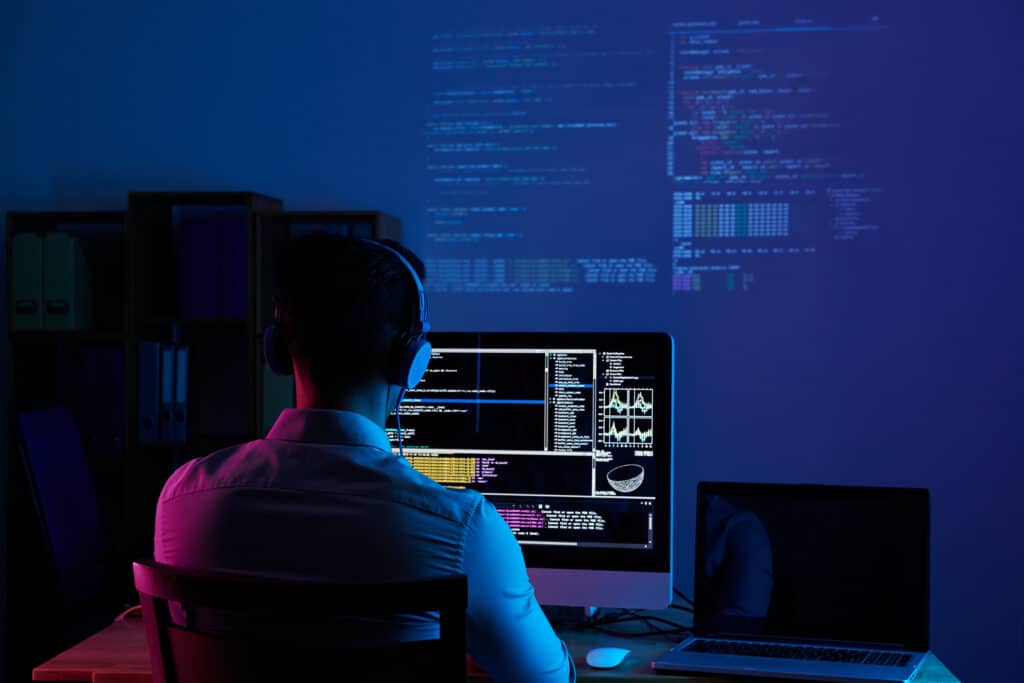 programmer working at night with wordpress development tools